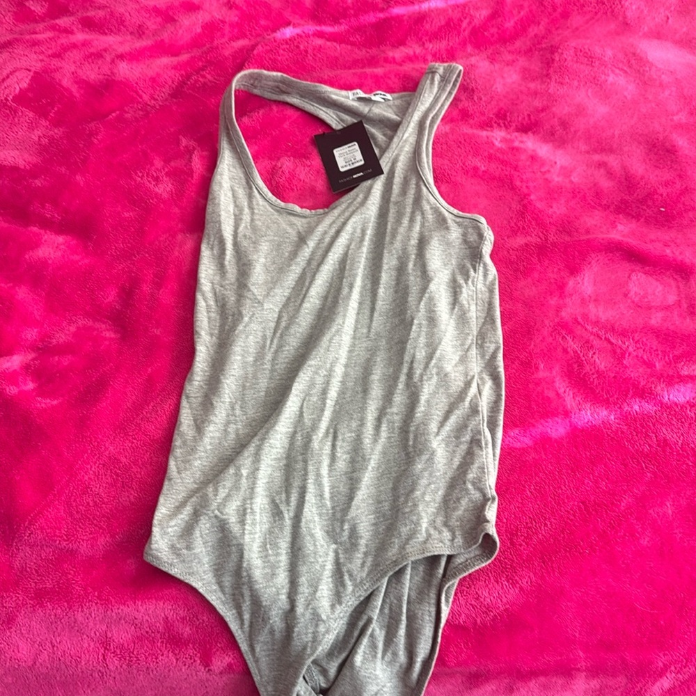 Brand new FashionNova Body Suit in heather gray!